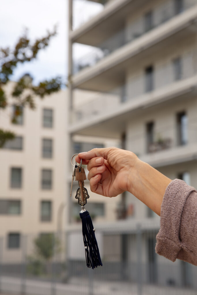 hand-holding-keys-outdoors
